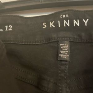 WHBM Black Skinny Jeans rips with shimmer